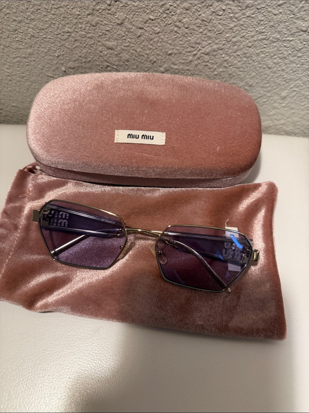 Miu Miu Gold Frame Sunglasses with Purple Lenses